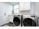 Laundry room with side-by-side washer and dryer, and built-in shelving at 10561 Sand Creek Blvd, Fishers, IN 46037