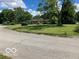 A single-story house featuring a well-maintained lawn and mature trees at 3141 W 33Rd St, Indianapolis, IN 46222