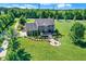 Aerial view of the backyard with a patio, firepit and professional landscaping at 13208 State Road 32 E, Noblesville, IN 46060