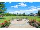 Backyard fire pit with seating, landscaping, and expansive lawn at 13208 State Road 32 E, Noblesville, IN 46060