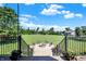 Expansive backyard view from a deck with a charming fire pit and seating area at 13208 State Road 32 E, Noblesville, IN 46060