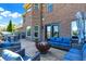 Cozy backyard deck with comfortable seating and a fire pit under string lights at 13208 State Road 32 E, Noblesville, IN 46060