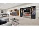 Finished basement with a kitchen area, ping pong table, and custom built-ins at 13208 State Road 32 E, Noblesville, IN 46060