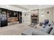 Cozy basement with stone fireplace, custom built-ins, and comfortable seating at 13208 State Road 32 E, Noblesville, IN 46060
