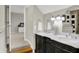 Bathroom vanity with double sinks, granite countertop, and modern fixtures, adjacent to the bedroom at 13208 State Road 32 E, Noblesville, IN 46060
