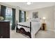 Cozy bedroom with a comfortable bed, soft lighting, and windows providing natural light at 13208 State Road 32 E, Noblesville, IN 46060