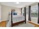 Bright bedroom with a bed, large windows, and neutral decor creating a relaxing atmosphere at 13208 State Road 32 E, Noblesville, IN 46060