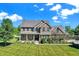 Beautiful two-story brick home with a well-manicured front lawn and landscaping at 13208 State Road 32 E, Noblesville, IN 46060
