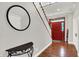 Entryway with wood floors, staircase, and red front door at 13208 State Road 32 E, Noblesville, IN 46060