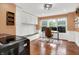 A home office space with built-in cabinets, bench, and a rustic accent rug at 13208 State Road 32 E, Noblesville, IN 46060