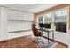 Bright home office features built-in cabinets and a large window overlooking the yard at 13208 State Road 32 E, Noblesville, IN 46060