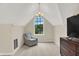 Bright sitting room with a large arched window and stylish chair at 13208 State Road 32 E, Noblesville, IN 46060