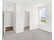 Bedroom with neutral carpeting, closet, and access to bathroom at 573 Carroll St, New Whiteland, IN 46184