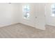 Well-lit bedroom with carpeting, window and door to hallway at 573 Carroll St, New Whiteland, IN 46184