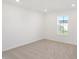 Simple bedroom with neutral carpeting and a window view at 573 Carroll St, New Whiteland, IN 46184