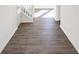 Bright entry hall with wood-look flooring and views to the living areas at 573 Carroll St, New Whiteland, IN 46184