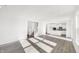 Sunlit Gathering room with kitchen and staircase views at 573 Carroll St, New Whiteland, IN 46184