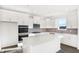 Modern kitchen featuring white cabinets, stainless steel appliances, and a large island at 573 Carroll St, New Whiteland, IN 46184