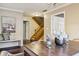 Dining room with hardwood floors and staircase view at 2011 Oldfields Cir S Dr, Indianapolis, IN 46228