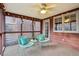 Relaxing screened porch with ceiling fan and string lights at 2011 Oldfields Cir S Dr, Indianapolis, IN 46228