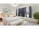 Stylish bedroom featuring a plush bed with gold accents, soft lighting, and a contemporary design, creating a relaxing retreat at 1560 Cold Spring Dr, Brownsburg, IN 46112