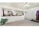 Open living space with a partial wall view of the dining area, offering a glimpse of the home's spacious and connected layout at 1560 Cold Spring Dr, Brownsburg, IN 46112