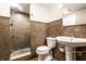 Well-lit bathroom with a modern vanity and an updated tiled shower stall at 25 E 40Th St # 6A, Indianapolis, IN 46205