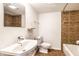 Clean bathroom with a bathtub, sink, and toilet at 25 E 40Th St # 6A, Indianapolis, IN 46205