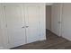 Bedroom with white trim, hard surface flooring, and closet with double doors at 3636 Salem St, Indianapolis, IN 46208
