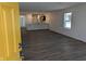 Open-concept living room with hardwood floors, bright white walls, and plenty of natural light at 3636 Salem St, Indianapolis, IN 46208