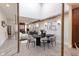 Dining area showcasing a large oval table, modern chairs, hardwood floors, and stylish lighting at 610 N Park Ave, Indianapolis, IN 46204