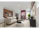 Cozy living room featuring a brick wall, comfortable sofa, modern decor, and exposed ductwork at 610 N Park Ave, Indianapolis, IN 46204