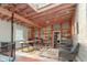 Bright office space featuring exposed brick, built-in shelving, and hardwood floors, offering a functional workspace at 610 N Park Ave, Indianapolis, IN 46204