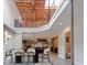 Open floor plan with a view of the dining area, kitchen, exposed wood beams, and modern finishes at 610 N Park Ave, Indianapolis, IN 46204