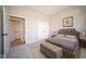 Bedroom featuring a neutral color scheme, a comfortable bed, and ample closet space at 7936 Beaumont Green Pl, Indianapolis, IN 46250
