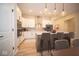 Modern kitchen featuring stainless steel appliances, a center island, and ample cabinet space at 7936 Beaumont Green Pl, Indianapolis, IN 46250