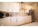 Bright kitchen with white cabinetry, stainless steel refrigerator, and modern countertops at 7936 Beaumont Green Pl, Indianapolis, IN 46250
