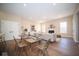 Cozy open concept living and dining area featuring modern furnishings and decor with plenty of natural light at 7942 Beaumont Green Pl, Indianapolis, IN 46250