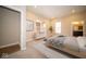 Bright main bedroom with neutral walls, carpet, modern decor, and ensuite bathroom at 7942 Beaumont Green Pl, Indianapolis, IN 46250