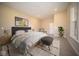 Comfortable main bedroom with carpet, neutral tones, decor, and ample space for relaxing and unwinding at 7942 Beaumont Green Pl, Indianapolis, IN 46250