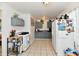 Functional kitchen featuring white appliances, gray cabinets, and neutral tile flooring at 3612 Schofield Ave, Indianapolis, IN 46218