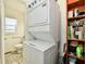 Stacked washer and dryer with access to the bathroom at 3612 Schofield Ave, Indianapolis, IN 46218