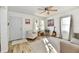 Bright living room with wood floors, natural light, and front door view at 3612 Schofield Ave, Indianapolis, IN 46218