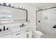 Elegant bathroom with double vanity, marble tile, and black accents at 1005 W 25Th St, Indianapolis, IN 46208