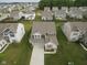 Aerial view of a home in a well-planned neighborhood with manicured lawns at 6748 Fallen Leaf Dr, Whitestown, IN 46075