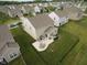 Aerial view of a home and backyard with a patio featuring outdoor seating and a grill at 6748 Fallen Leaf Dr, Whitestown, IN 46075