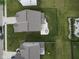 Aerial view of two homes showcasing fenced backyards and outdoor patios with seating and dining at 6748 Fallen Leaf Dr, Whitestown, IN 46075