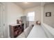 Cozy bar area features a granite countertop, wooden cabinets, mini refrigerator, and shelving at 6748 Fallen Leaf Dr, Whitestown, IN 46075