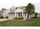 Charming two-story home featuring a two-car garage and a welcoming covered entry at 6748 Fallen Leaf Dr, Whitestown, IN 46075