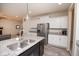 Bright kitchen featuring white cabinets, stainless steel appliances and a large island with granite countertops at 6748 Fallen Leaf Dr, Whitestown, IN 46075